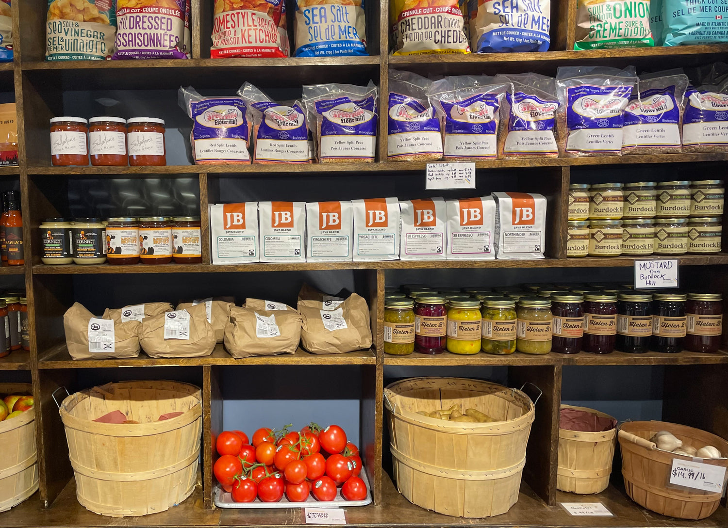 Display shelves at Osprey Roost full of grocery items and vegetables